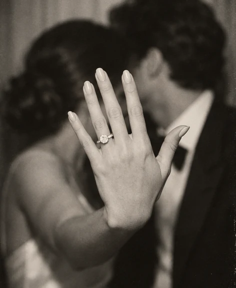 Photo booth picture: her hand and the engagement ring